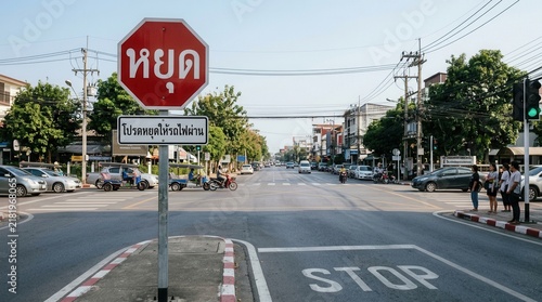 Busy Intersection With Stop Sign And Traffic Flow In Asia