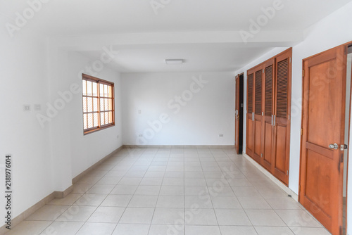 Empty Room with Wooden Wardrobe and Window