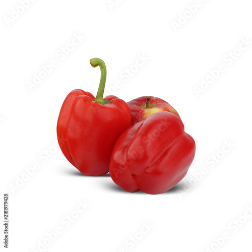 two red bell peppers next to an apple