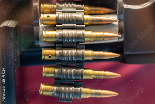 фотографія Belted military rifle ammunition cartridges held in metal link clips