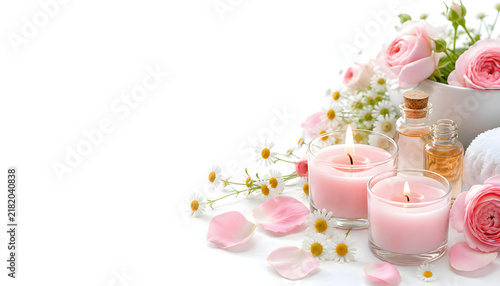 ピンクのアロマキャンドルとバラの花を飾ったスパ背景