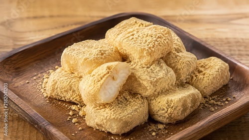 Traditional Korean Injeolmi Rice Cakes with Soybean Powder in Elegant Rustic Setting