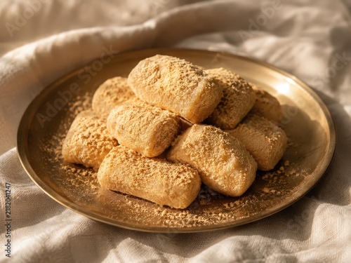 Traditional Korean Injeolmi Rice Cakes with Soybean Powder in Elegant Rustic Setting