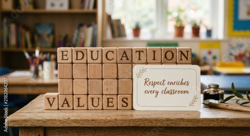 Wooden cubes spell out education values with a respect quote on a table