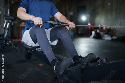 Konstfotografi Adult man performing cable row exercise on rowing machine during strength traini