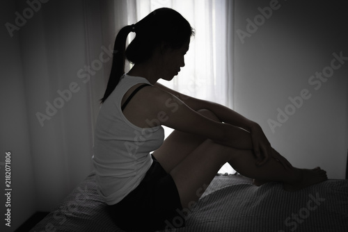 Canvastavla Depressed woman expressing fear and loneliness, representing abuse, harassment, exploitation and forced labor, with a message of hope, support, justice and freedom