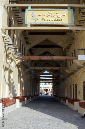 Fotografie A sign hanging beneath traditional timber crossbeams marks the entrance to the c
