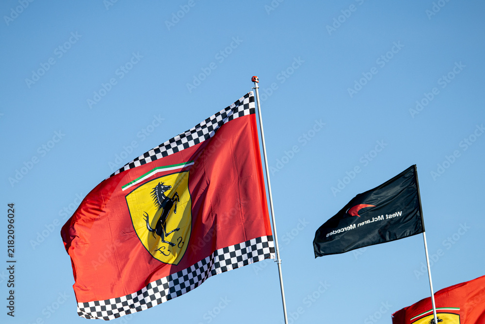 Obraz premium 24 May 2026, Montreal, Canada: Ferrari flags wave above Formula 1 fans at Grand Prix weekend. g.