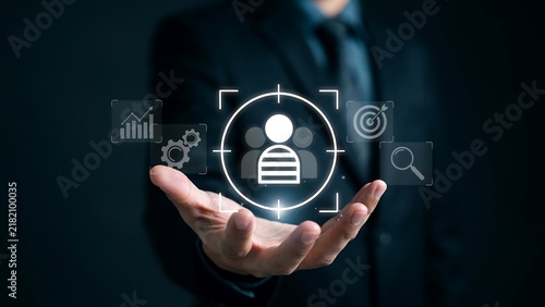 Professional Businessman Holding Digital Interface Representing Strategic Customer Targeting and Data Analysis Growth