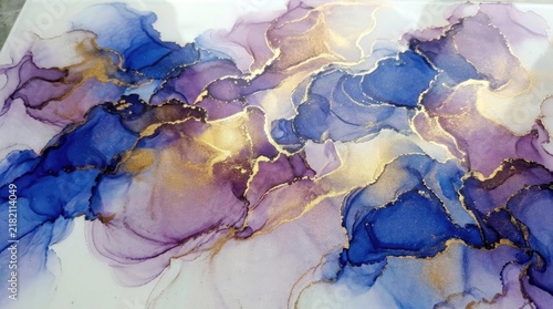 Abstract alcohol ink art with blue purple and gold