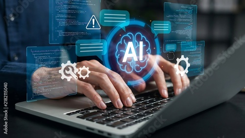 A developer uses a laptop with futuristic holographic artificial intelligence interface icons to perform advanced software coding tasks