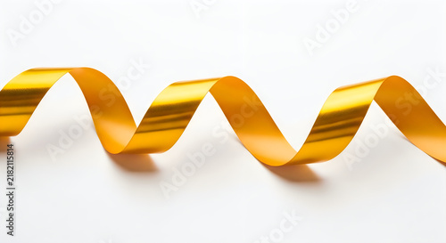 Fototapeta Golden ribbon swirl on white background isolated on white background