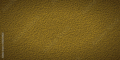 Golden yellow textured background with rough abstract pattern and dark vignette border