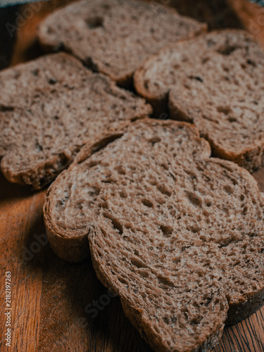Bild auf Leinwand Four Wholegrain Bread Slices Arranged in Cross Pattern, Top-Down Crumb Texture D