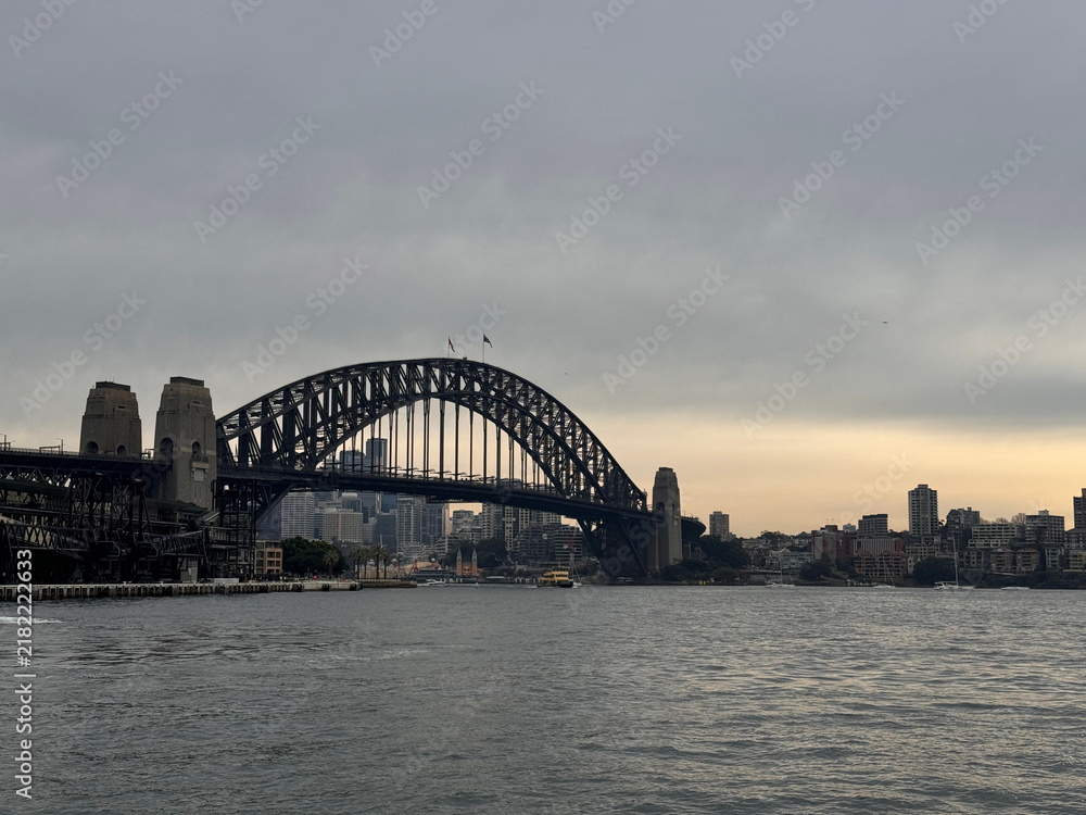 Fototapeta premium Sydney Harbour Bridge at dusk with the city skyline across the water