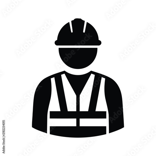 Construction worker wearing a hard hat and safety vest, ready for work on a busy construction site.