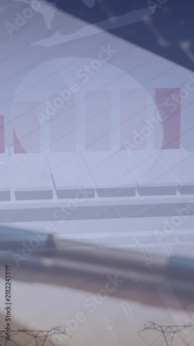 Animation of statistical data processing against close up of a pen, notepad and laptop