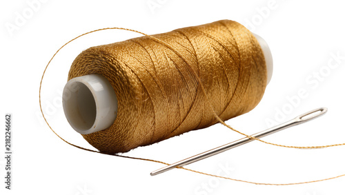 Bild auf Leinwand Golden thread spool with needle, isolated on transparent background