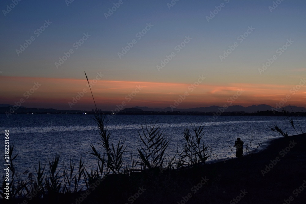 Obraz premium fishing at sunset Alba Cagliaro Sardegna sardinia Italia italy 