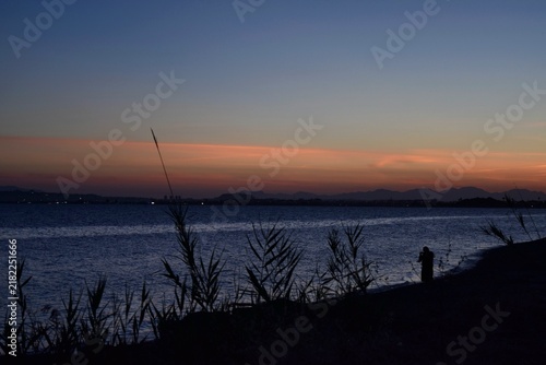 Bild auf Leinwand fishing at sunset
Alba
Cagliaro
Sardegna sardinia 
Italia italy