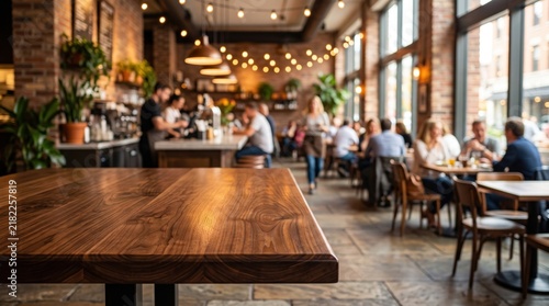 Dark brown hardwood tabletop in the foreground with a blurred busy cafe interior featuring brick walls wooden chairs people sitting at tables and warm string lights hanging from the ceiling