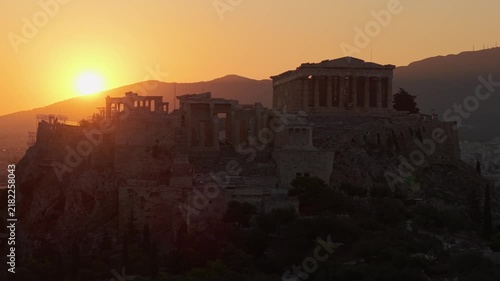 Stunning sunset aerial view of Parthenon temple on Acropolis hill in Athens Greece.