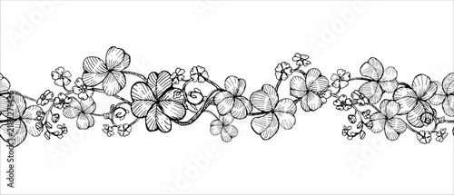 Seamless clover and forget-me-not border hand drawn vector ink sketch. Illustration for Patricks day greeting cards, Irish branding, celtic festival decor and rustic wedding invitation luxury frames.