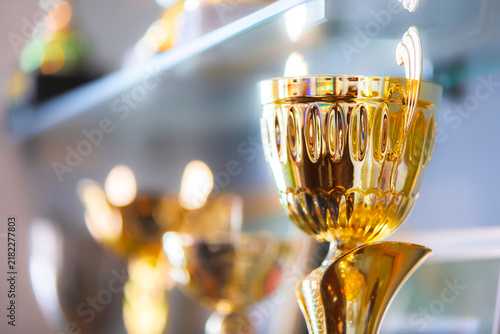 Trophy display showing various awards and prizes in a bright setting at a competition event