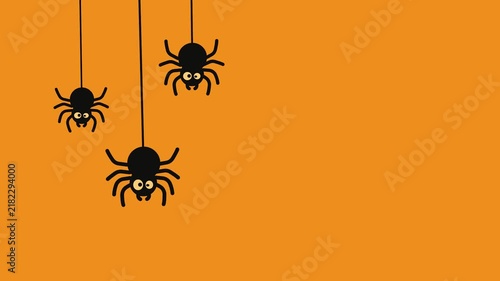 Whimsical trio of black cartoon spiders with expressive eyes hanging on a bright orange background for holiday fun.