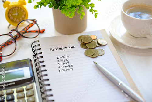 Happy senior woman managing personal finances at home with table and saving document.  Financial Wellness for retirement Concept