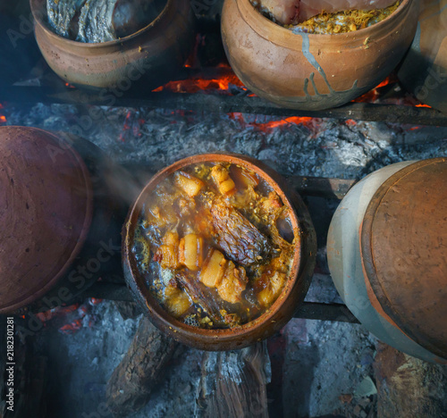 Traditional Vietnamese Braised Fish in a Clay Pot Over a Wood Fire