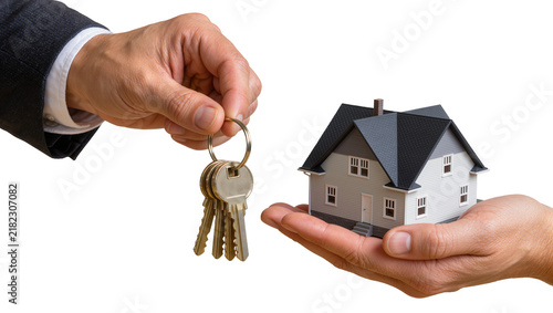 Man s hand in suit giving keys to another hand holding a miniature house, isolated on transparent background
