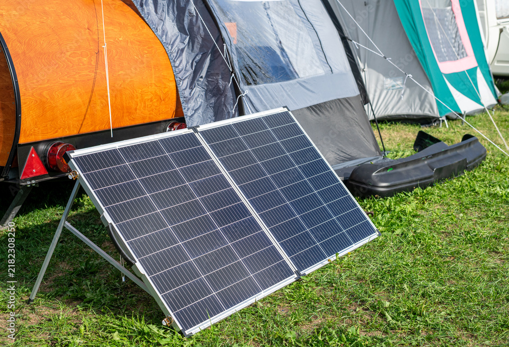 Obraz premium Portable Solar Panel for Electricity While Camping Outdoors
