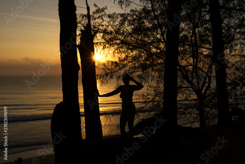 Woman pretty with silhouette and sunrise