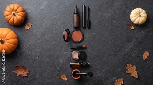 Elegant Halloween Cosmetic Product Arrangement with Seasonal Styling