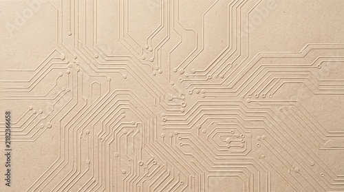 Abstract embossed circuit board pattern on light brown paper, a subtle background for technology and digital themes