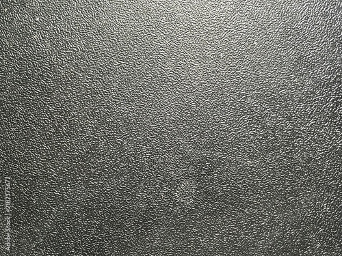 Metallic silver brushed steel surface with rough industrial texture