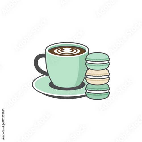 Mint green coffee cup with three macarons.