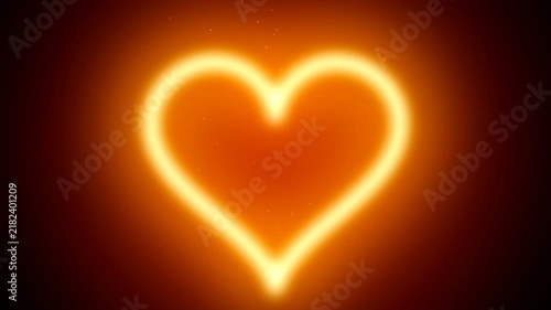 Glowing yellow heart shape burning with fiery orange light on dark background