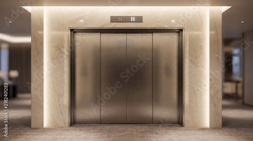 Modern luxury elevator doors in contemporary building lobby interior with warm lighting.