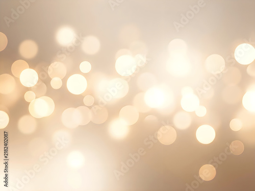 Abstract golden bokeh background with soft glowing lights and blurred circles for festive holiday, celebration, or luxury design projects