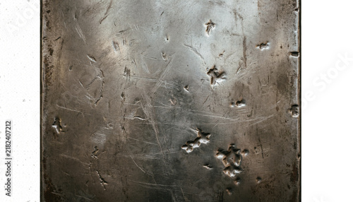 Industrial scratched metal plate, weathered steel texture with dents and scratches, rugged metallic background for heavy-duty design