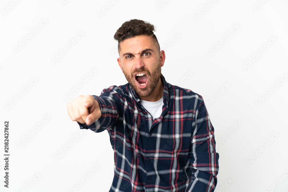 Fototapeta premium Caucasian man isolated on white background frustrated and pointing to the front