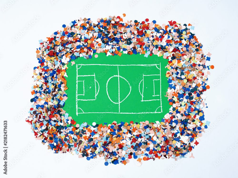 Fototapeta premium Chalk Hand Drawn Soccer Pitch on Green Paper Framed by Colorful Confetti Representing a Packed Stadium Crowd
