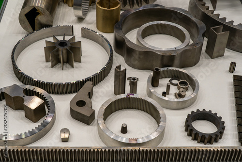 Bild auf Leinwand Industrial metal machine parts including gears, toothed rings, bushings, shafts