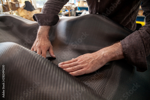 Laying carbon fiber into a car seat mold