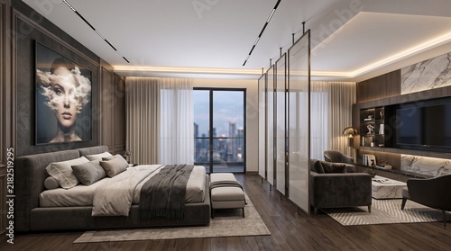A luxury apartment bedroom features an open floor plan with a king size bed and a seating area showing a city skyline view through the window which creates a comfortable space for relaxing travel