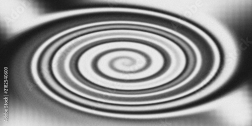 Monochromatic spiral vortex with concentric circles in soft focus during abstract motion