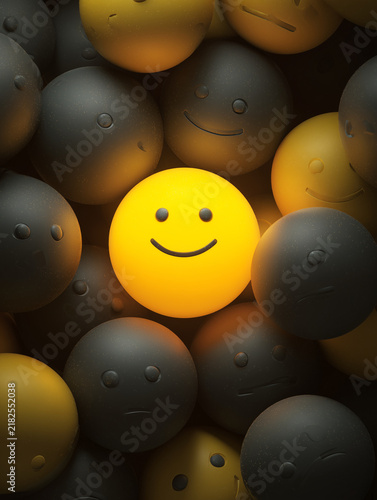 Glowing yellow smiley face standing out from crowd