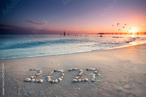 happy new year 2027 on the beach in sunset light